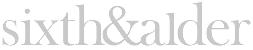 The image shows the text "sixth&alder" in a large, gray font.